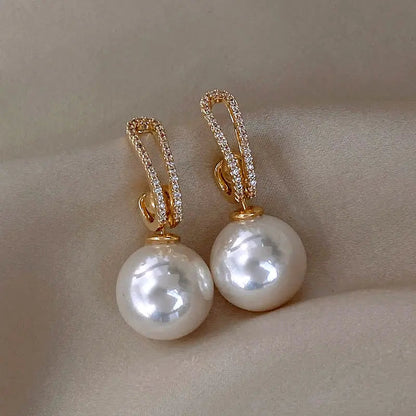 Boucles d'oreilles élégantes avec perles et brillants | Or