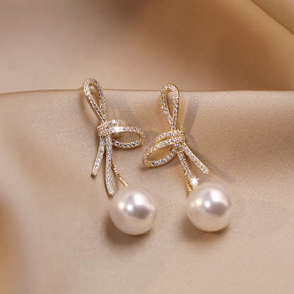 Boucles d'oreilles en perles avec bande brillante | Or