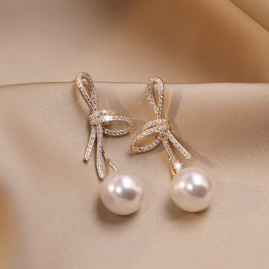 Boucles d'oreilles en perles avec bande brillante | Or