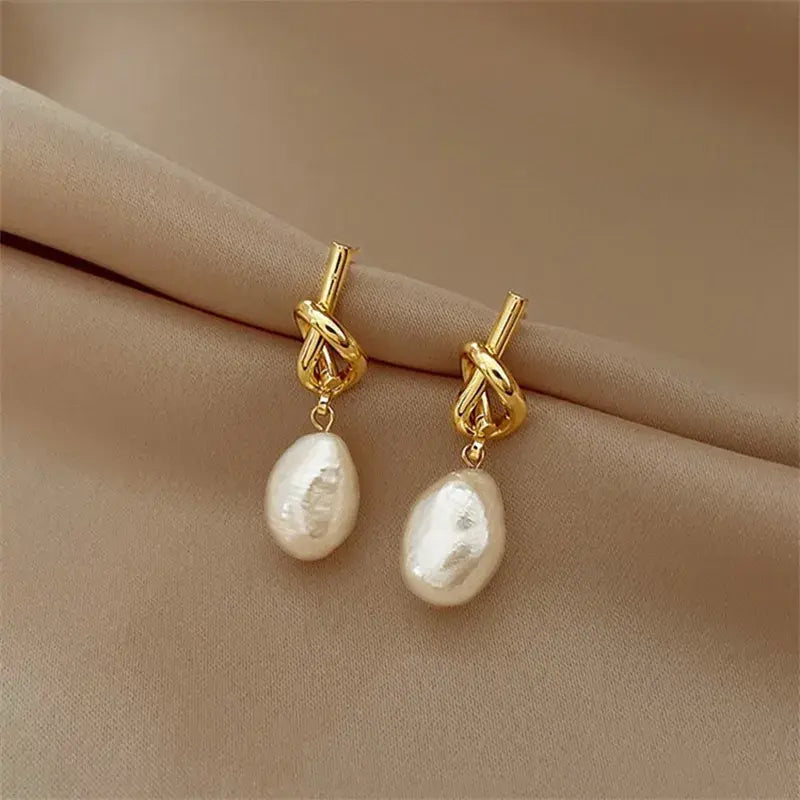 Boucles d'oreilles pendantes avec perles baroques | Or