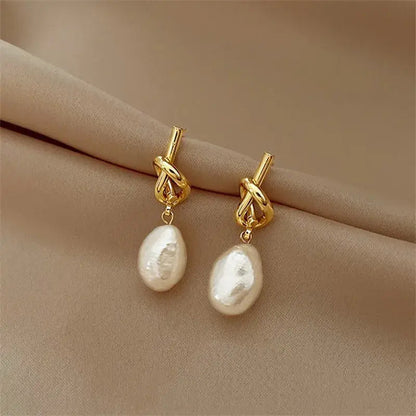 Boucles d'oreilles pendantes avec perles baroques | Or