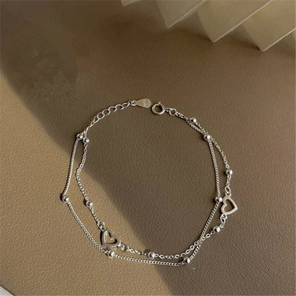 Bracelet ajustable avec cœur | Or blanc