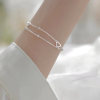 Bracelet ajustable avec cœur | Or blanc