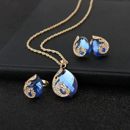 Ensemble de collier et boucles d'oreilles en cristal bleu avec dorure | Or